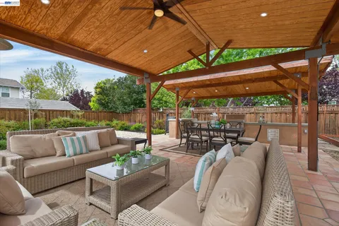 a outdoor living space with patio furniture and a potted plant