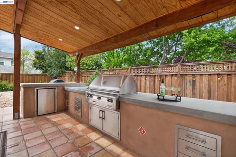 a kitchen with a table and chairs