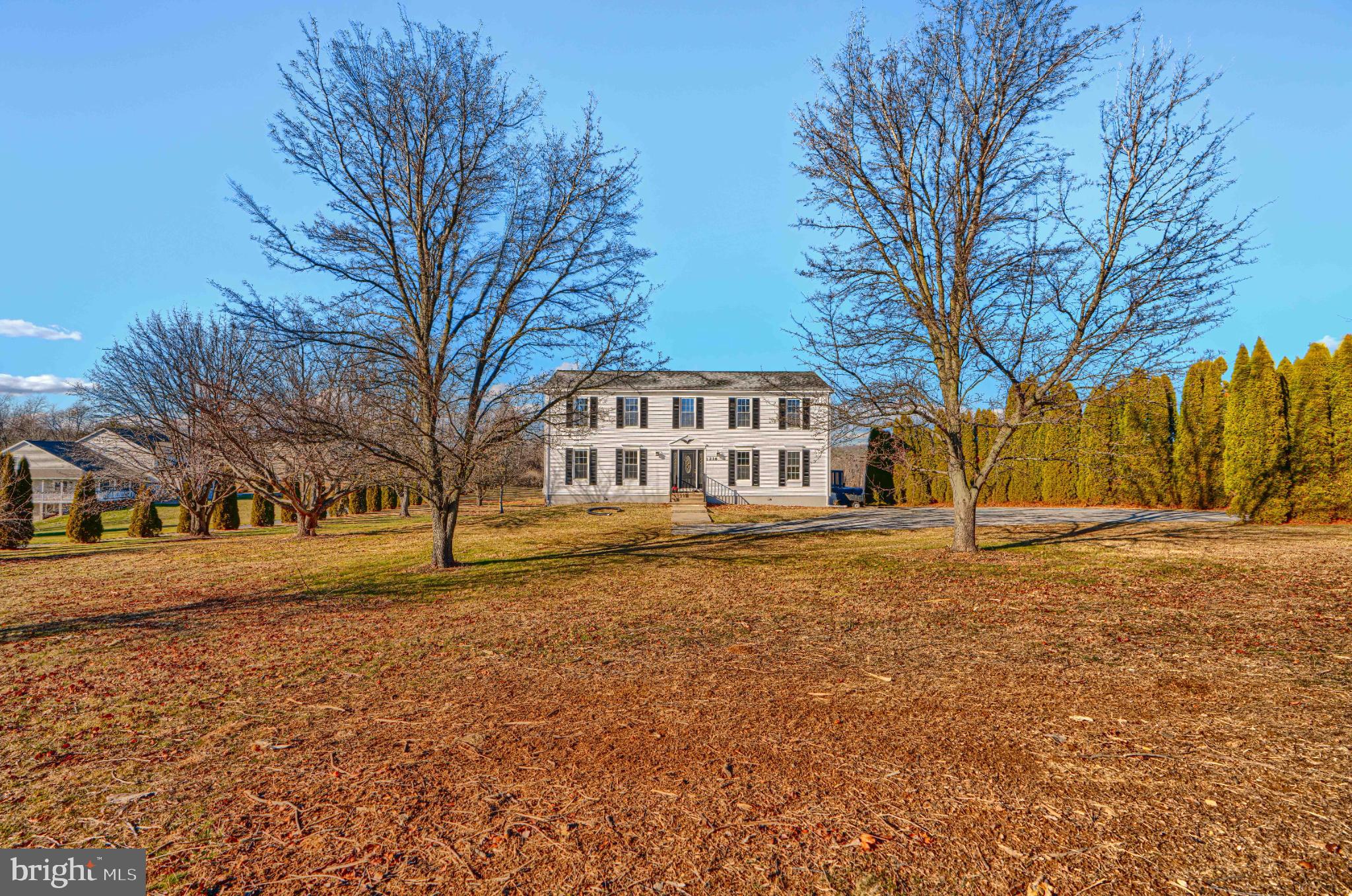 Charming home on spacious, serene grounds.