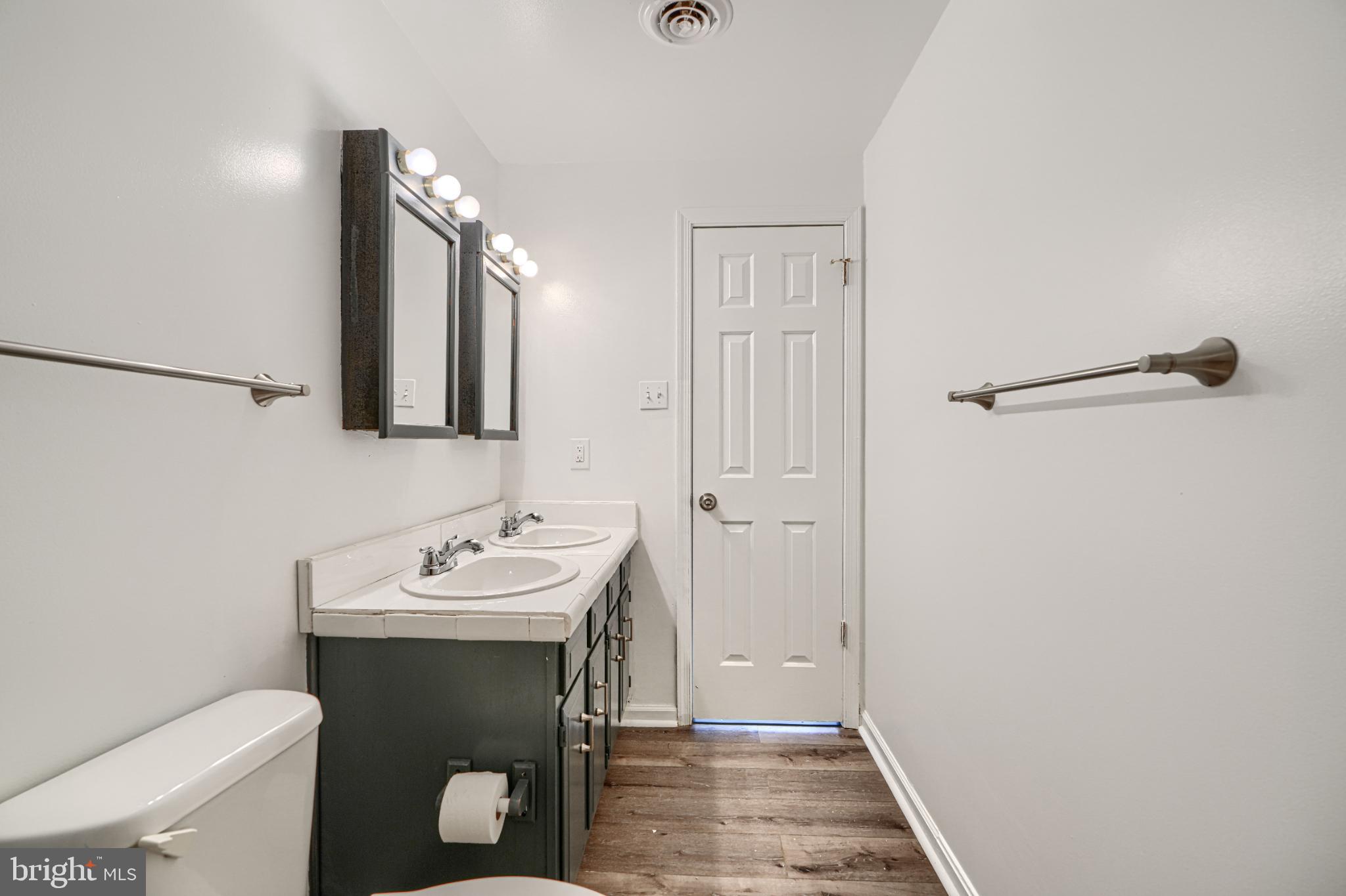 1216 Bachmans Valley Road Westminster, MD 21158 - Photo 43 of 70 a bathroom with a sink toilet and mirror