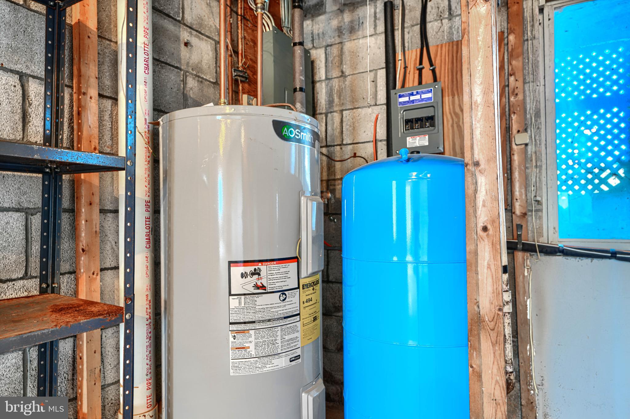 1216 Bachmans Valley Road Westminster, MD 21158 - Photo 56 of 70 Utility space with water heater and tank.