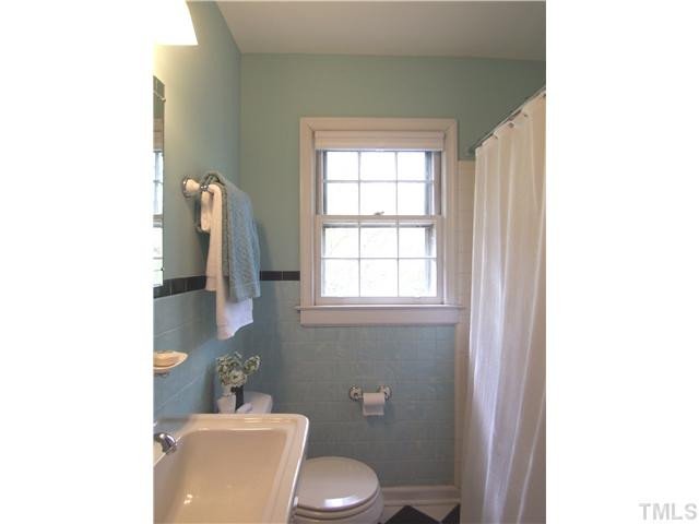104 West Whitaker Mill Road Raleigh, NC 27608 - Photo 18 of 25 a bathroom with a toilet and a sink
