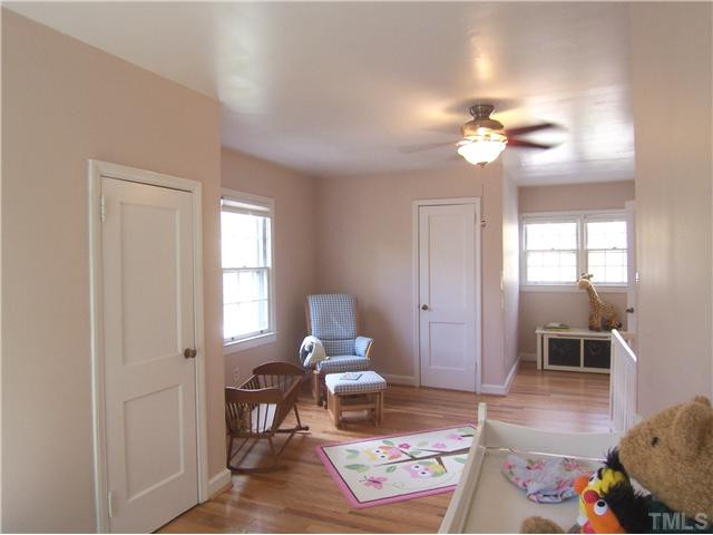 104 West Whitaker Mill Road Raleigh, NC 27608 - Photo 20 of 25 a living room with furniture a dining table and a window