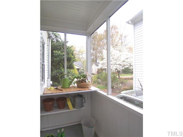 104 West Whitaker Mill Road Raleigh, NC 27608 - Photo 21 of 25 a room with a large window and couch