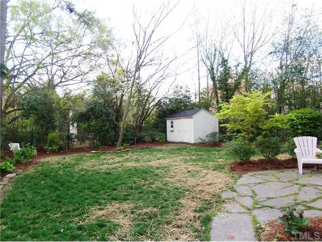104 West Whitaker Mill Road Raleigh, NC 27608 - Photo 25 of 25 a backyard of a house with lots of green space