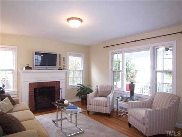 104 West Whitaker Mill Road Raleigh, NC 27608 - Photo 5 of 25 a living room with furniture and a fireplace