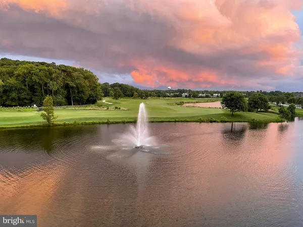 a view of lake with houses in the back