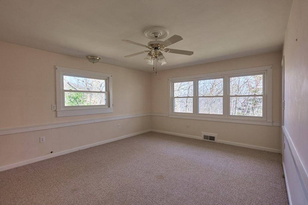 2871 Hogback Mountain Road Tryon, NC 28782 - Photo 30 of 33 an empty room with a window and a fan