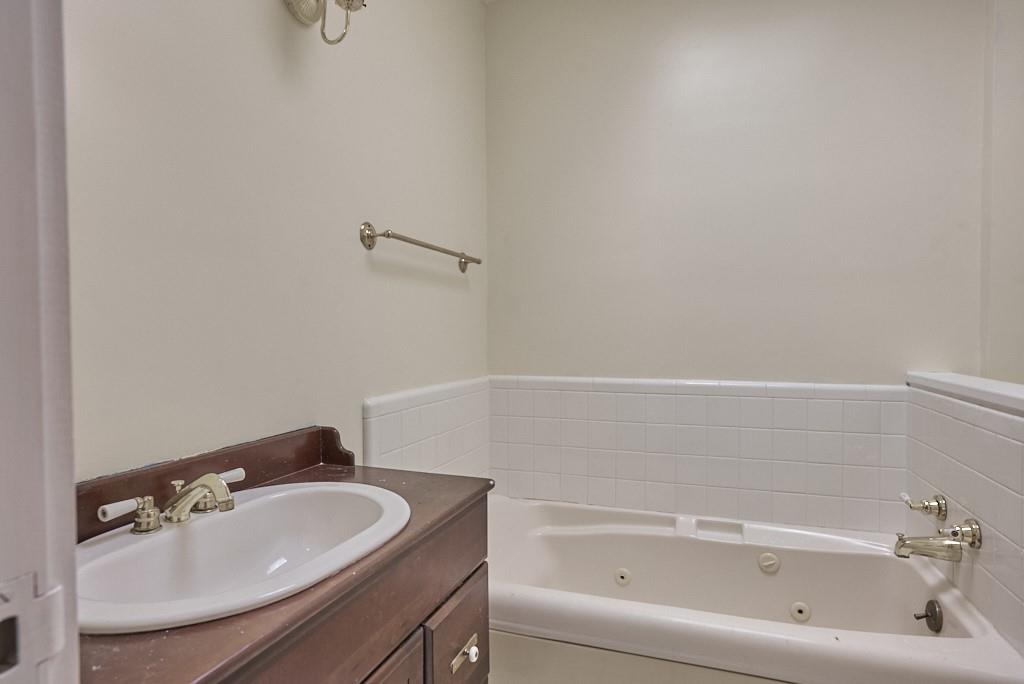 2871 Hogback Mountain Road Tryon, NC 28782 - Photo 33 of 33 a white bath tub sitting next to a white sink and vanity