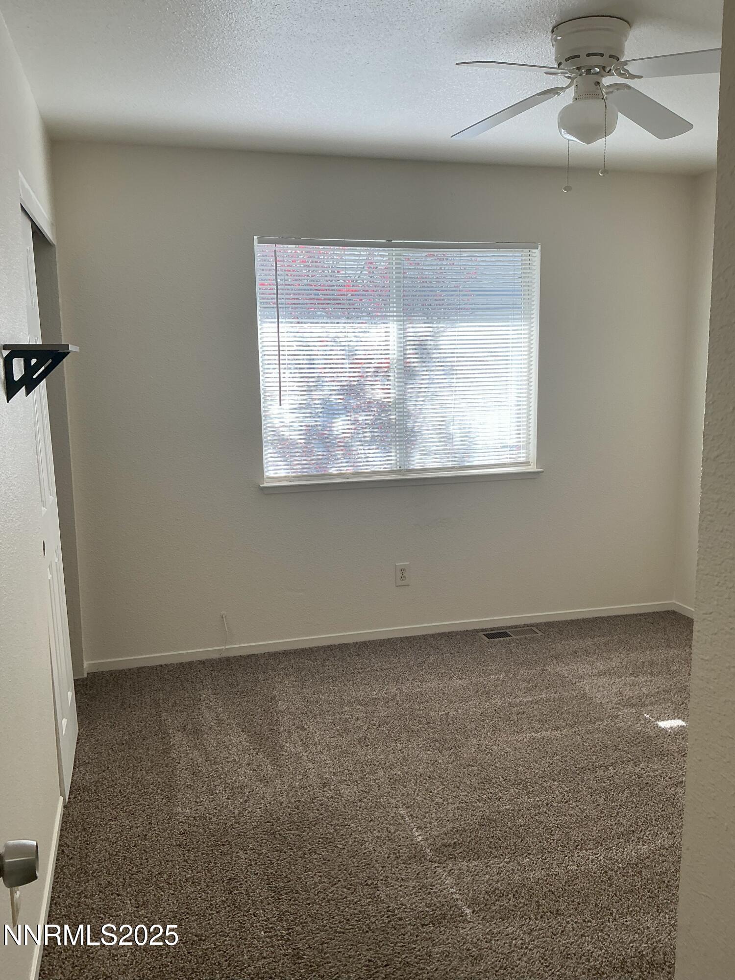 3913 Pheasant Drive Carson City, NV 89701 - Photo 11 of 12 an empty room with a window