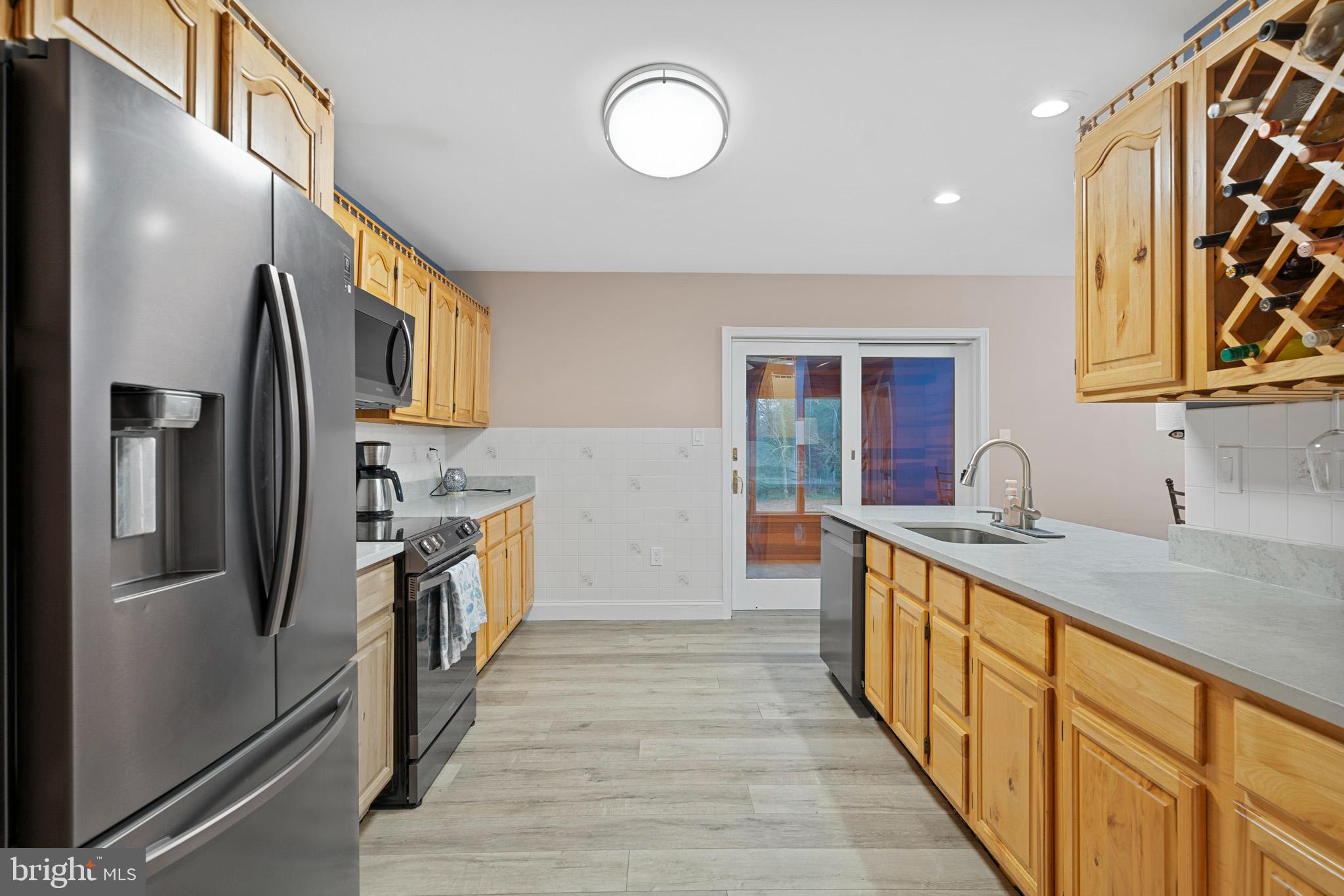 13340 Rousby Hall Road Lusby, MD 20657 - Photo 20 of 71 LVP flooring throughout