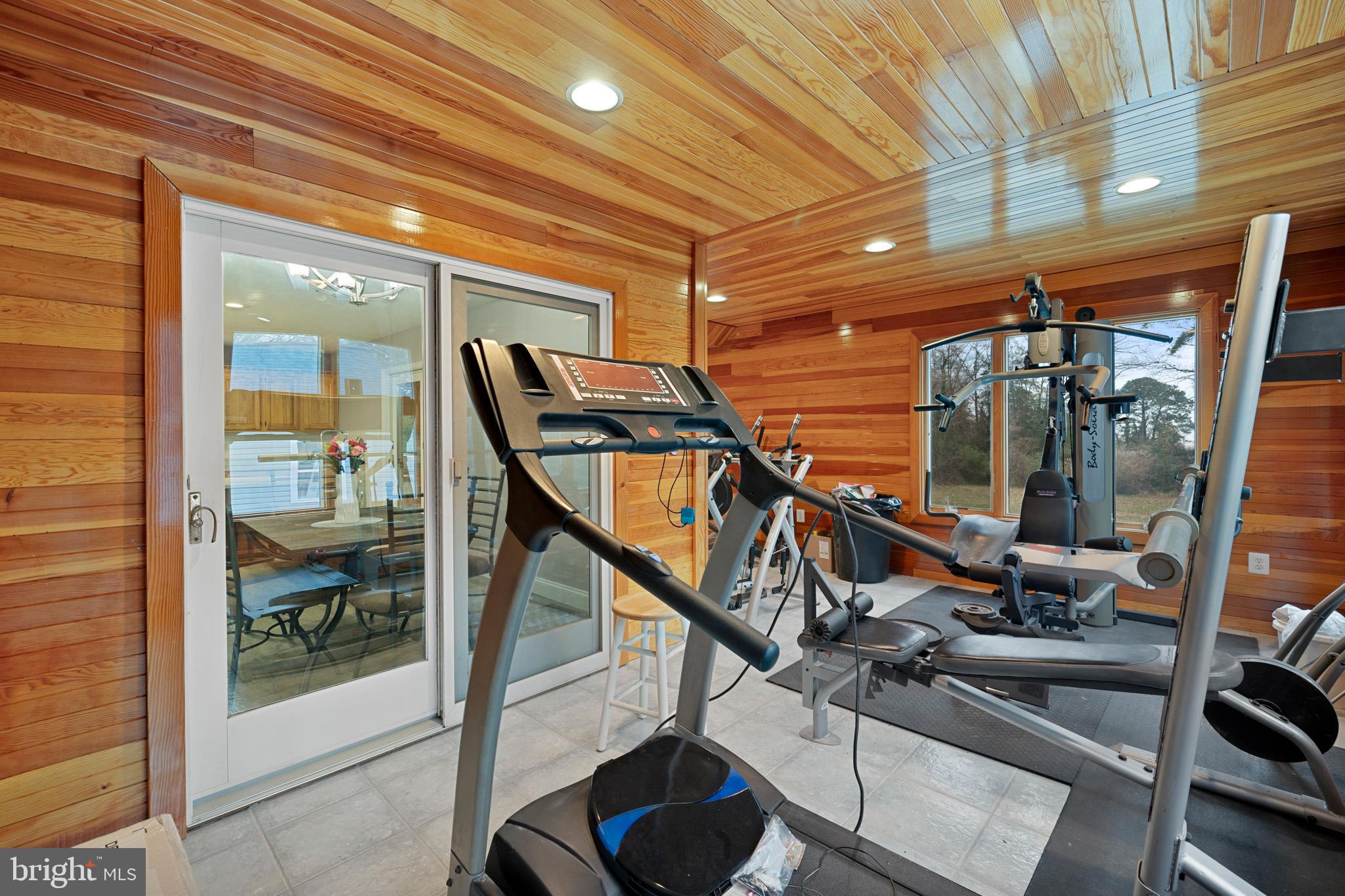 13340 Rousby Hall Road Lusby, MD 20657 - Photo 30 of 71 Sunroom w/ multiple sliding glass doors for access