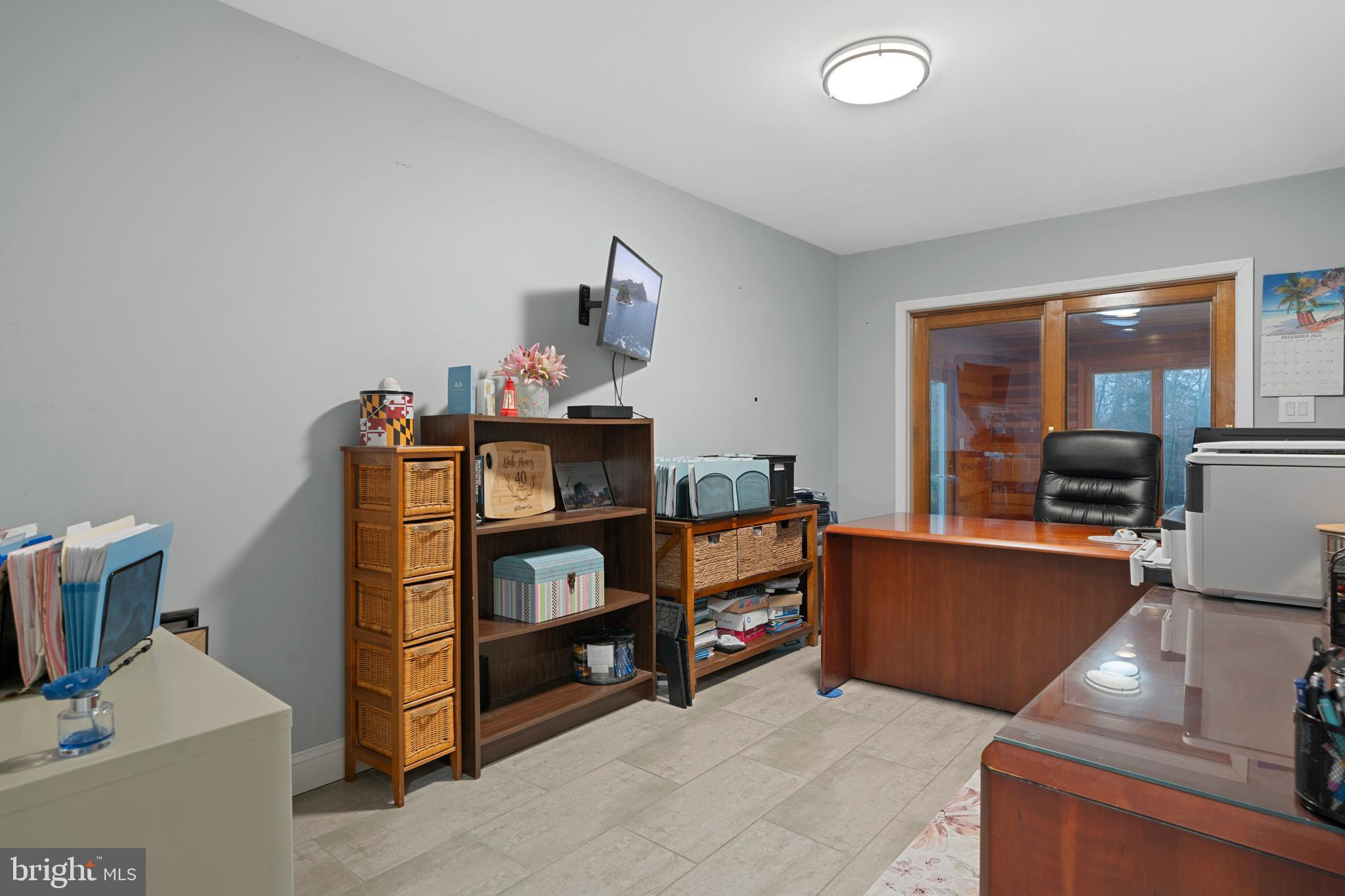 13340 Rousby Hall Road Lusby, MD 20657 - Photo 33 of 71 Main level office w/ slider to sunroom