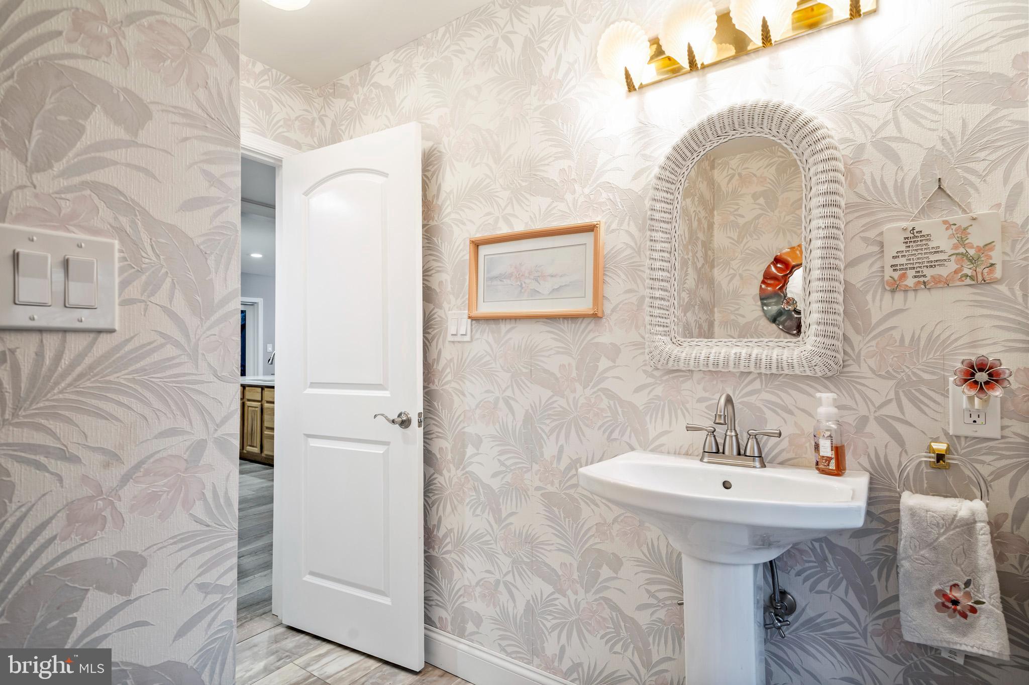 13340 Rousby Hall Road Lusby, MD 20657 - Photo 35 of 71 main level half bath