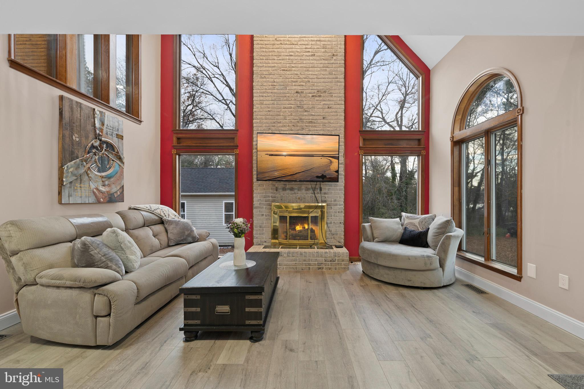 13340 Rousby Hall Road Lusby, MD 20657 - Photo 8 of 71 Gas insert with brick surround fireplace