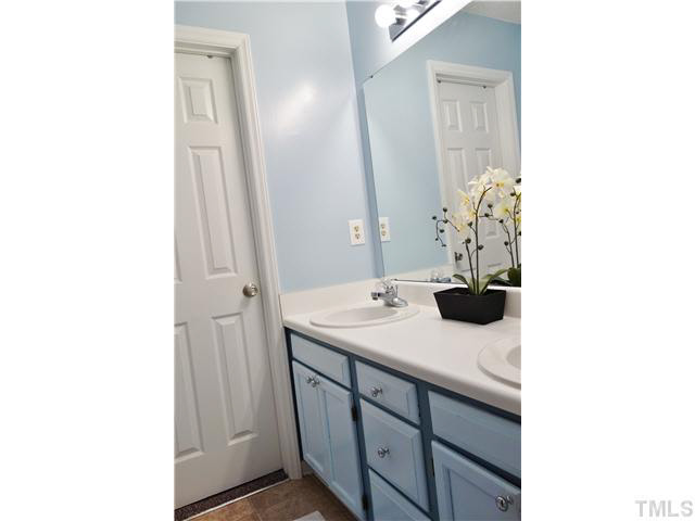 4420 Labrador Drive Raleigh, NC 27616 - Photo 10 of 21 a bathroom with a sink and a mirror