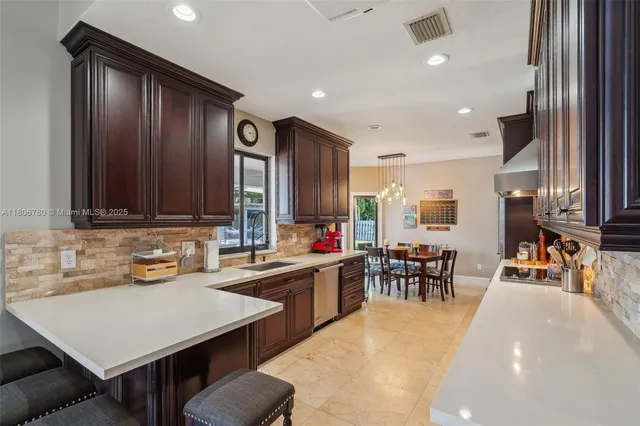 a kitchen with a sink and appliances