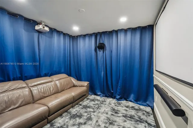 a living room with a bed furniture and a wooden door