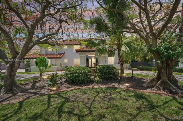 a swimming pool with outdoor seating and yard