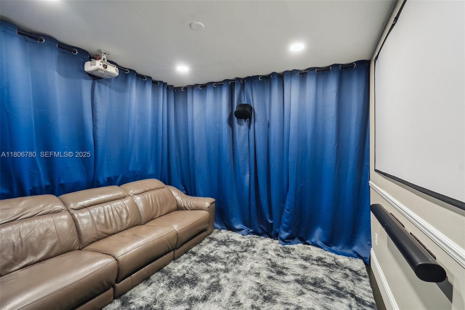 11898 Southwest 74th Terrace Miami, FL 33183 - Photo 48 of 68 a living room with a bed furniture and a wooden door