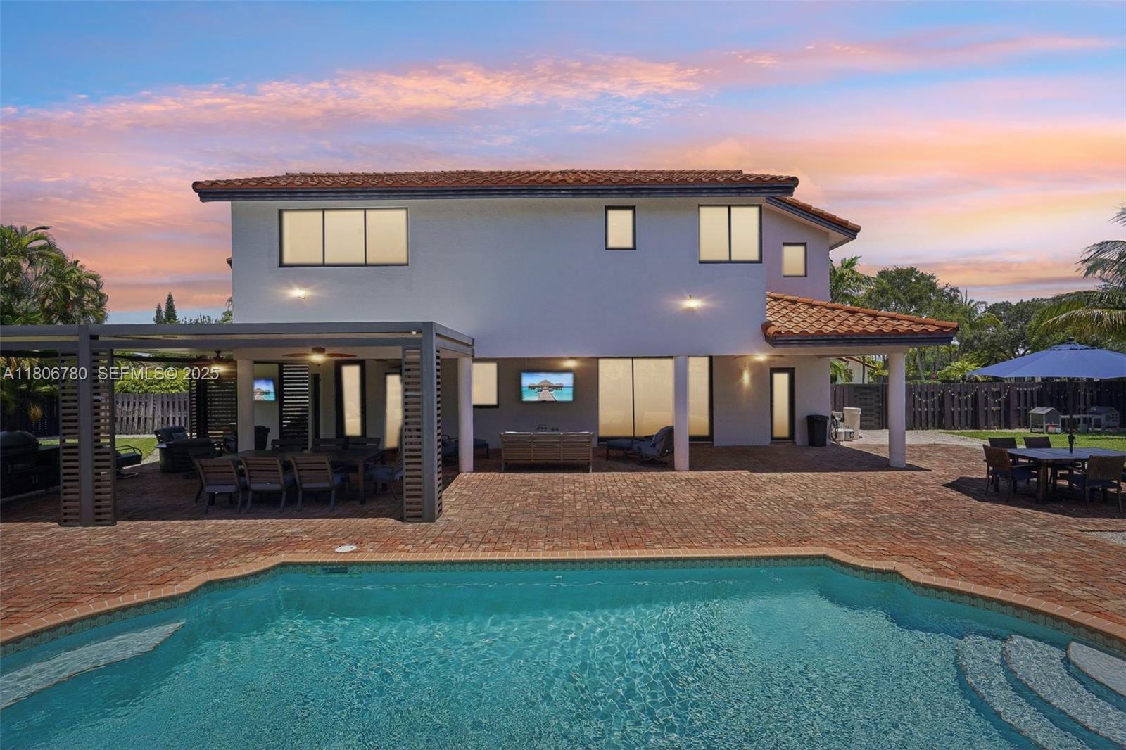 11898 Southwest 74th Terrace Miami, FL 33183 - Photo 53 of 68 a view of a house with a yard and a patio