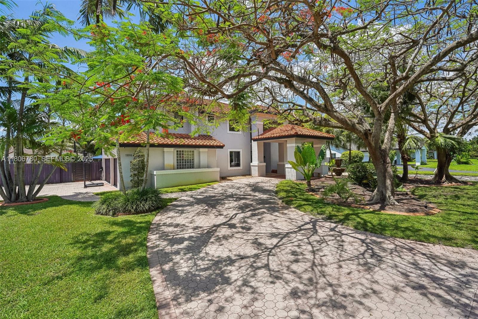 11898 Southwest 74th Terrace Miami, FL 33183 - Photo 55 of 68 a view of a house with a yard and tree s