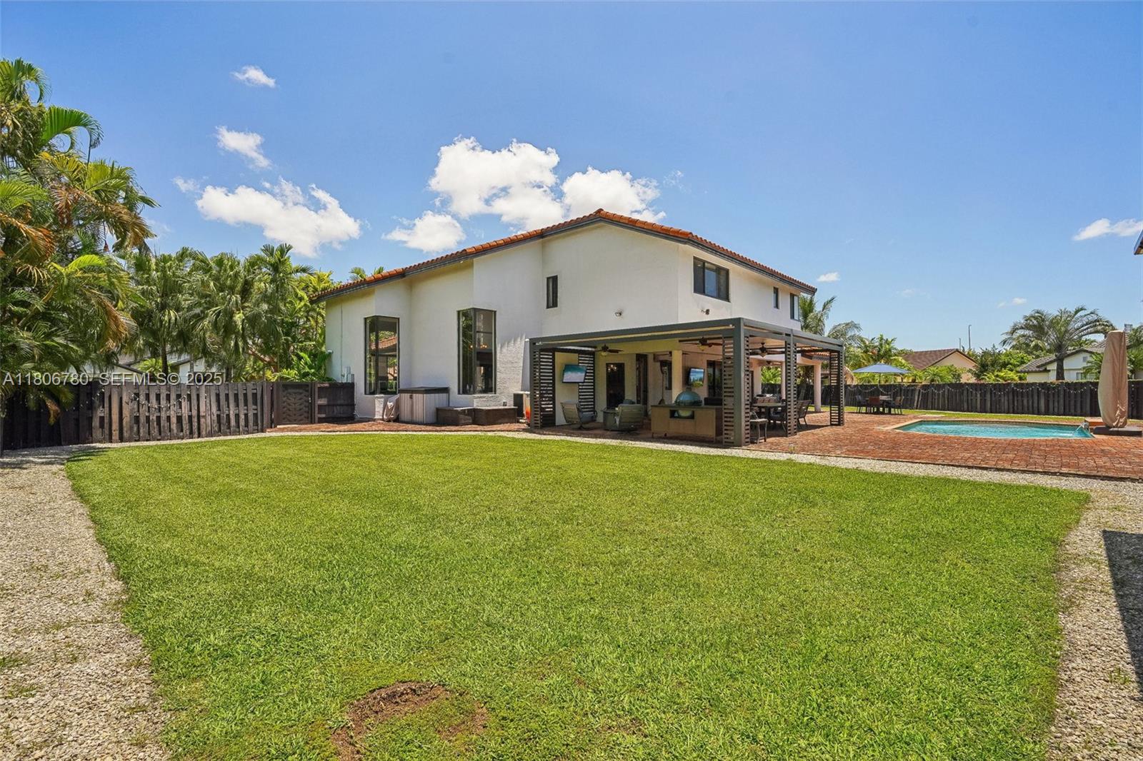 11898 Southwest 74th Terrace Miami, FL 33183 - Photo 57 of 68 a view of house with outdoor space and swimming pool
