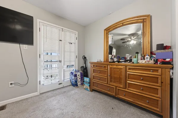 a room with furniture and a flat screen tv