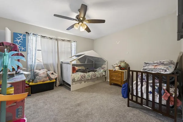 a bedroom with furniture and a chandelier