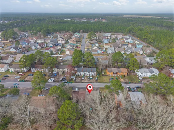 an aerial view of city and lake