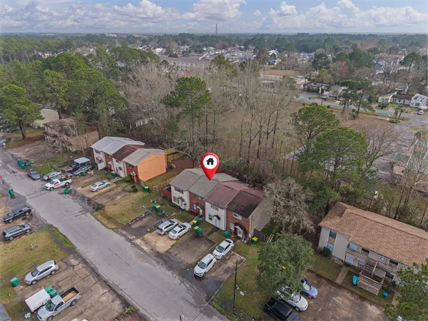 an aerial view of a house with a garden