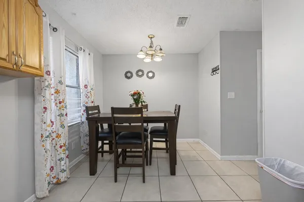 an aerial view of multiple house with a yard