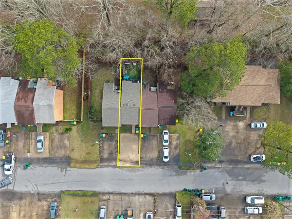 an aerial view of a house with outdoor space