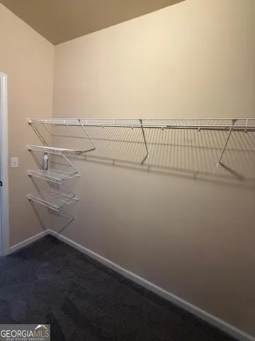 a view of a room with racks on the wall