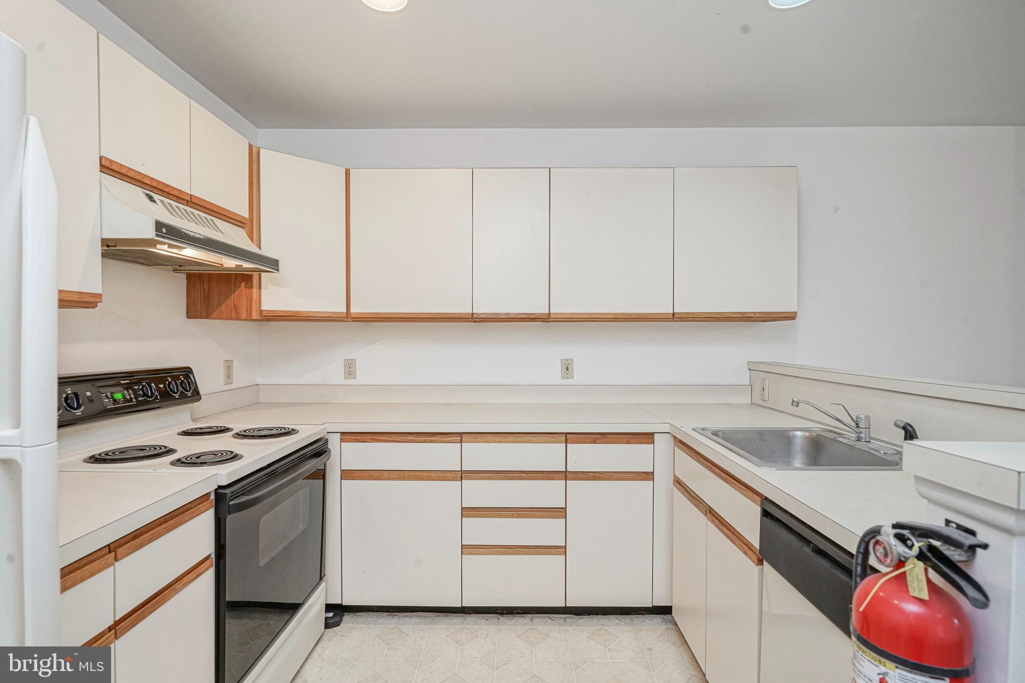 46 Brainerd Street, Unit A Mount Holly, NJ 08060 - Photo 8 of 19 a kitchen with cabinets appliances a sink and a counter top