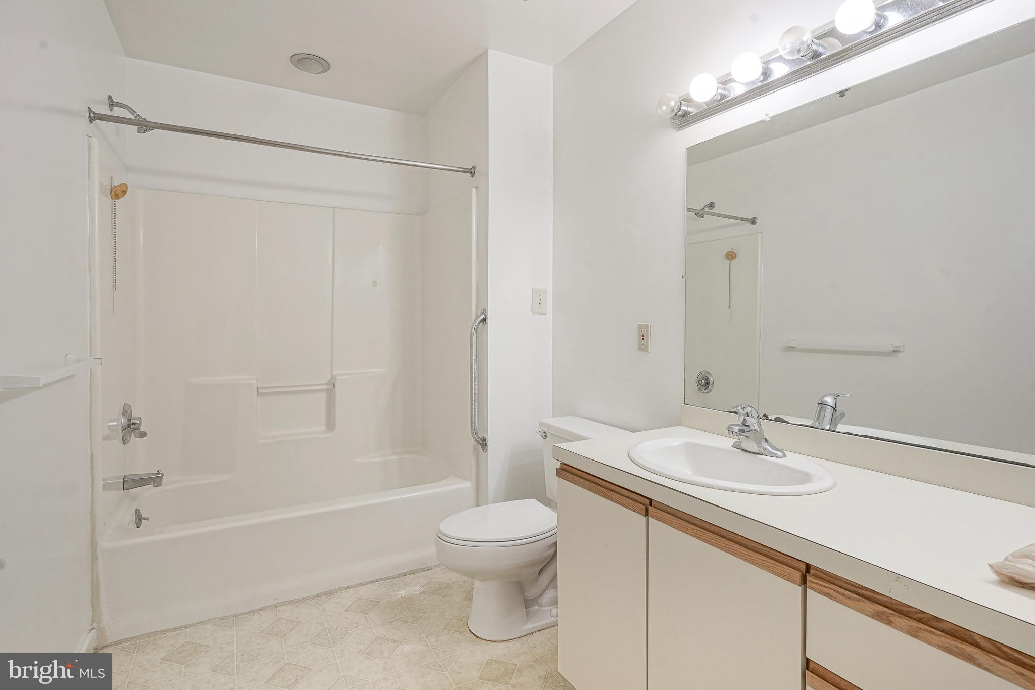 46 Brainerd Street, Unit A Mount Holly, NJ 08060 - Photo 10 of 19 a bathroom with a sink a toilet and a bathtub