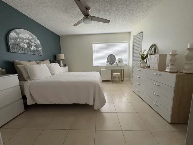 a bedroom with a bed and a table