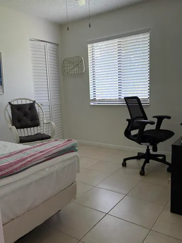 a living room with a chair and a coffee table