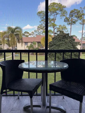 a view of a chairs and table on the terrace