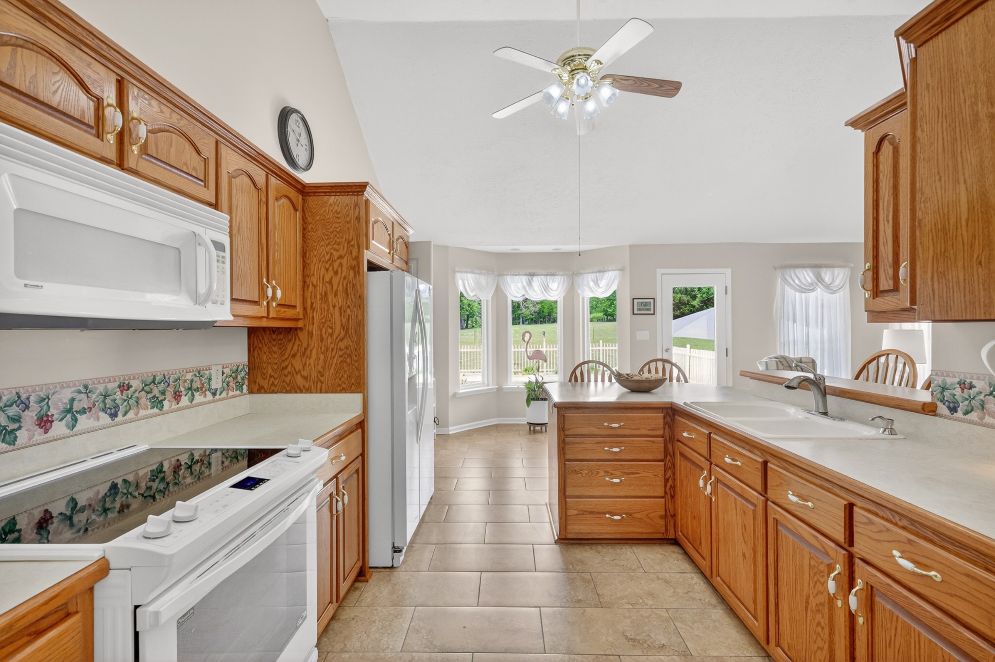590 Allisona Road Eagleville, TN 37060 - Photo 18 of 55 a kitchen with a stove a sink and a refrigerator