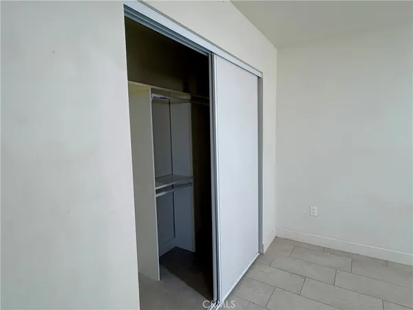 a view of a hallway with a potted plant