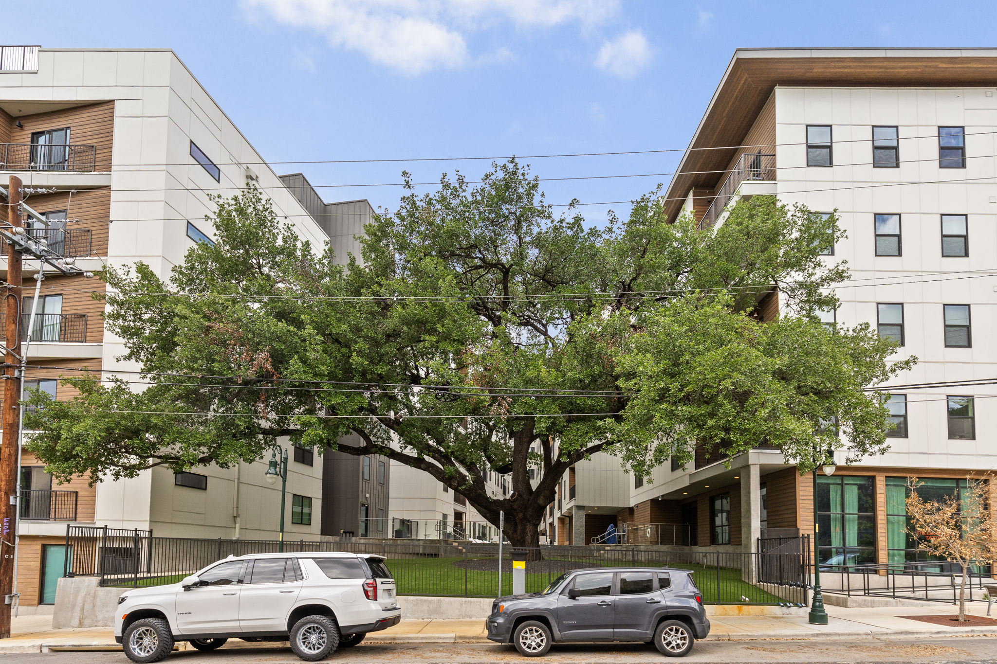 2500 Longview Street, Unit 507 Austin, TX 78705 - Photo 3 of 37 View of apartment building / complex featuring a fenced front yard