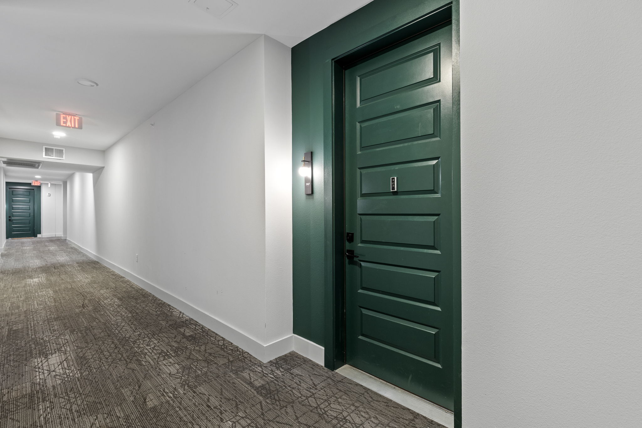 2500 Longview Street, Unit 507 Austin, TX 78705 - Photo 6 of 37 Hall with baseboards and carpet flooring