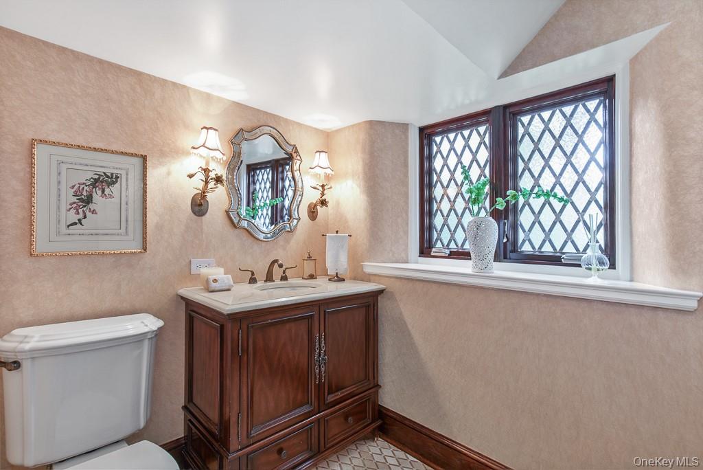 21 Hampshire Road Bronxville, NY 10708 - Photo 15 of 41 The formal powder room is discretely positioned off the entrance hall and features beautiful finishes.