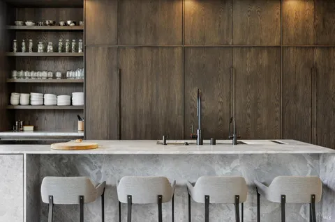 a kitchen with a table and chairs