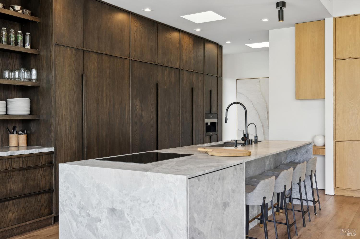 297 Seadrift Road Stinson Beach, CA 94970 - Photo 13 of 44 a kitchen with kitchen island a sink a counter and a refrigerator