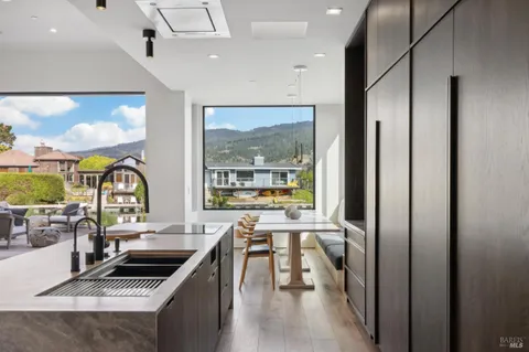 a kitchen with stainless steel appliances a stove sink and cabinets