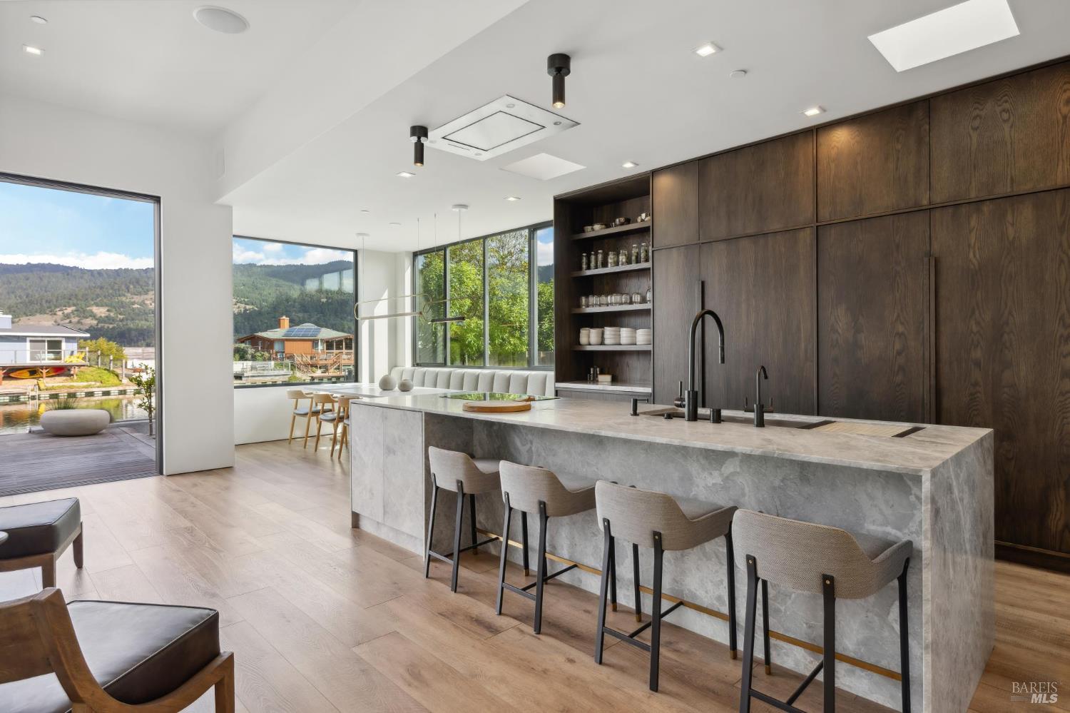 297 Seadrift Road Stinson Beach, CA 94970 - Photo 9 of 44 a large kitchen with a table and chairs