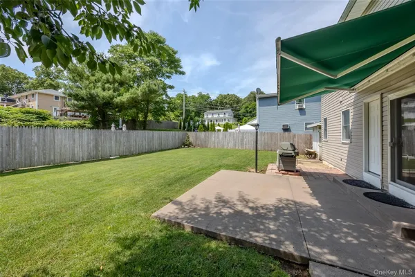 a view of a back yard with a patio
