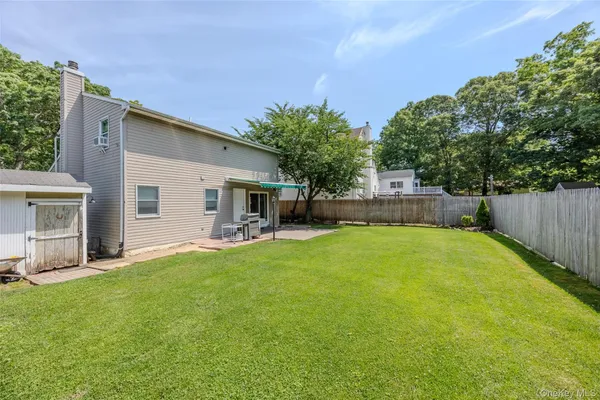 a view of a backyard with a garden and plants